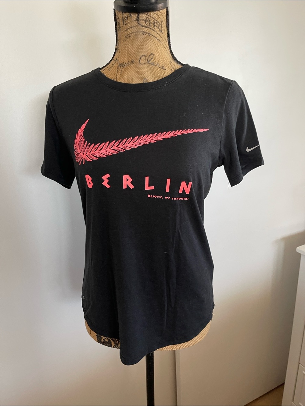 Nike Black Short Sleeve Graphic Tee with Pink Swoosh and BERLIN Print
